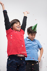 Image showing kids  blowing confetti