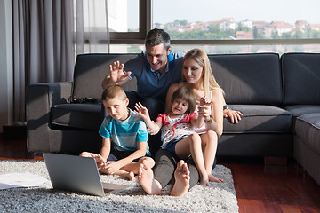 Image showing Family Playing Together with laptop computer