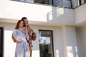 Image showing Young beautiful couple in bathrobes