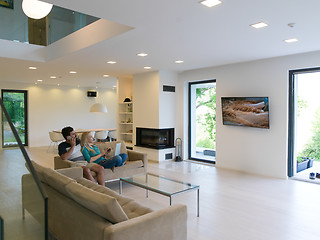 Image showing young happy couple relaxes in the living room