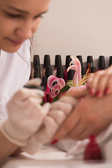 Image showing Woman hands receiving a manicure