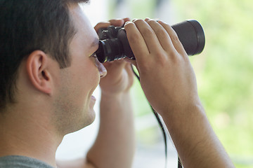 Image showing man looking with binoculars