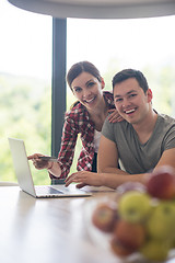 Image showing happy young couple buying online