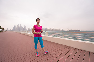 Image showing young woman celebrating a successful training run