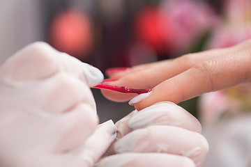 Image showing Woman hands receiving a manicure