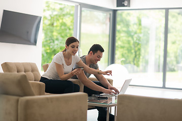 Image showing happy young couple buying online