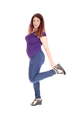 Image showing Curvy woman standing in profile with leg up