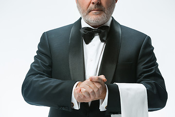 Image showing Senior waiter with white towel. Sign language in the restaurant