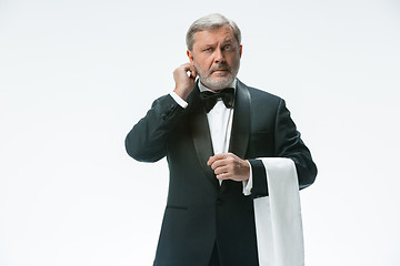 Image showing Senior waiter with white towel. Sign language in the restaurant