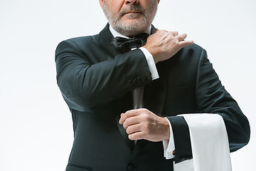 Image showing Senior waiter with white towel. Sign language in the restaurant