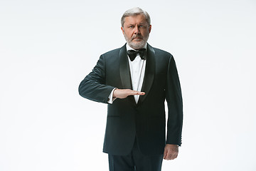 Image showing Senior waiter with white towel. Sign language in the restaurant