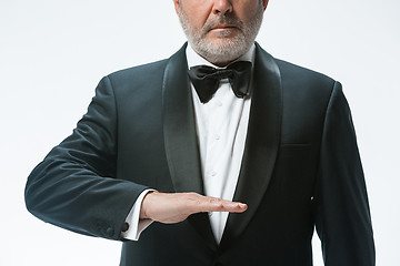 Image showing Senior waiter with white towel. Sign language in the restaurant