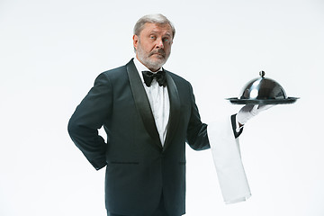 Image showing The waiter with tray and metal cloche lid cover