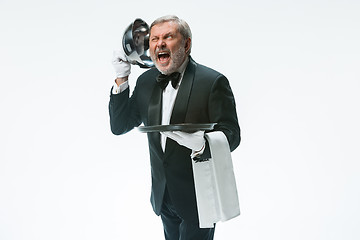 Image showing The waiter with tray and metal cloche lid cover