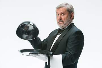 Image showing The waiter with tray and metal cloche lid cover