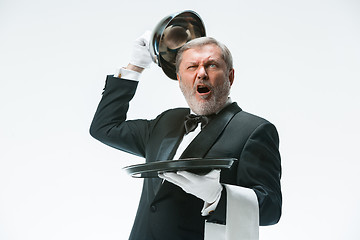 Image showing The waiter with tray and metal cloche lid cover