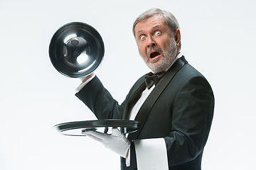 Image showing The waiter with tray and metal cloche lid cover