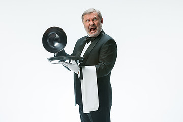 Image showing The waiter with tray and metal cloche lid cover