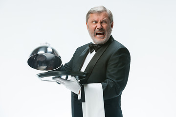 Image showing The waiter with tray and metal cloche lid cover