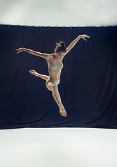 Image showing Young teen dancer ion white floor background.