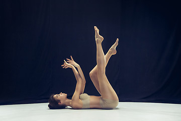 Image showing Young teen dancer ion white floor background.