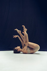 Image showing Young teen dancer ion white floor background.