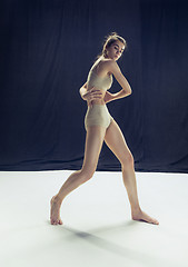 Image showing Young teen dancer ion white floor background.