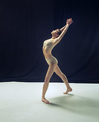 Image showing Young teen dancer ion white floor background.