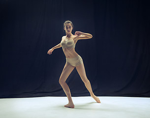 Image showing Young teen dancer ion white floor background.