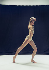 Image showing Young teen dancer ion white floor background.