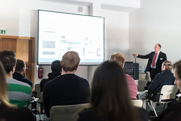 Image showing Business speaker giving a talk at business conference event.