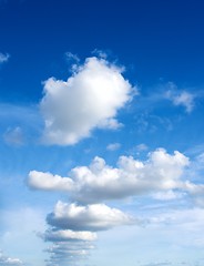 Image showing Fluffy Clouds In a Row