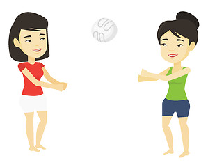 Image showing Two women playing beach volleyball.