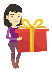 Image showing Joyful asian woman holding box with gift.