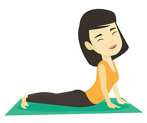 Image showing Woman practicing yoga upward dog pose.