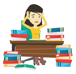 Image showing Student sitting at the table with piles of books.