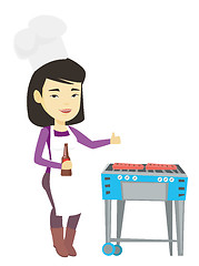 Image showing Woman cooking steak on barbecue grill.