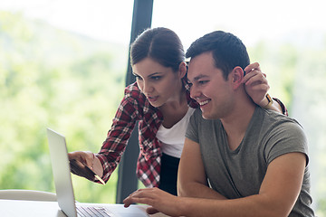 Image showing happy young couple buying online