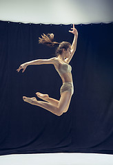 Image showing Young teen dancer ion white floor background.