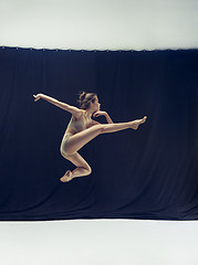 Image showing Young teen dancer ion white floor background.