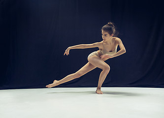 Image showing Young teen dancer ion white floor background.