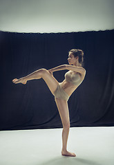 Image showing Young teen dancer ion white floor background.