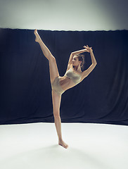 Image showing Young teen dancer ion white floor background.