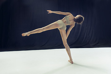 Image showing Young teen dancer ion white floor background.