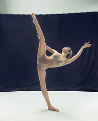 Image showing Young teen dancer ion white floor background.