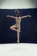 Image showing Young teen dancer ion white floor background.