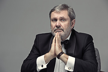 Image showing Senior Businessman sitting in chair