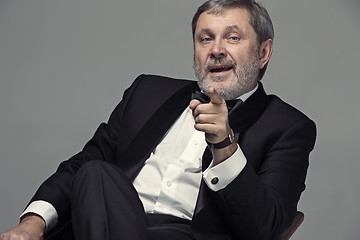 Image showing Senior Businessman sitting in chair