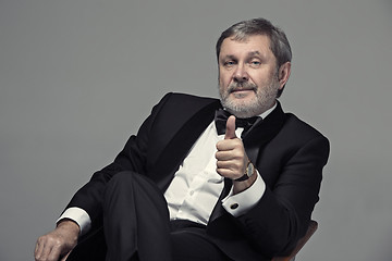 Image showing Senior Businessman sitting in chair