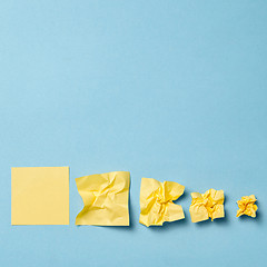 Image showing crumpled paper ball isolated on a blue background